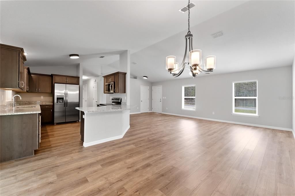 Chandelier, Empty room, Interior, Kitchen, Pendant Lights, Stainless Steel Appliances, Wood Texture Flooring