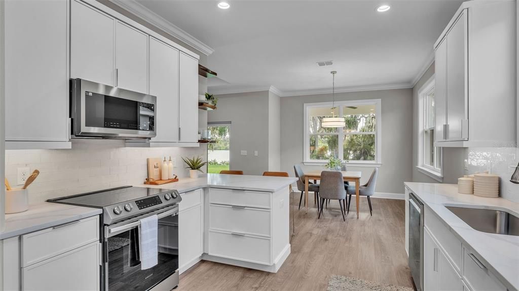 Dining room, Interior, Kitchen, Pendant Lights, Recessed Lighting, Stainless Steel Appliances, Wood Texture Flooring
