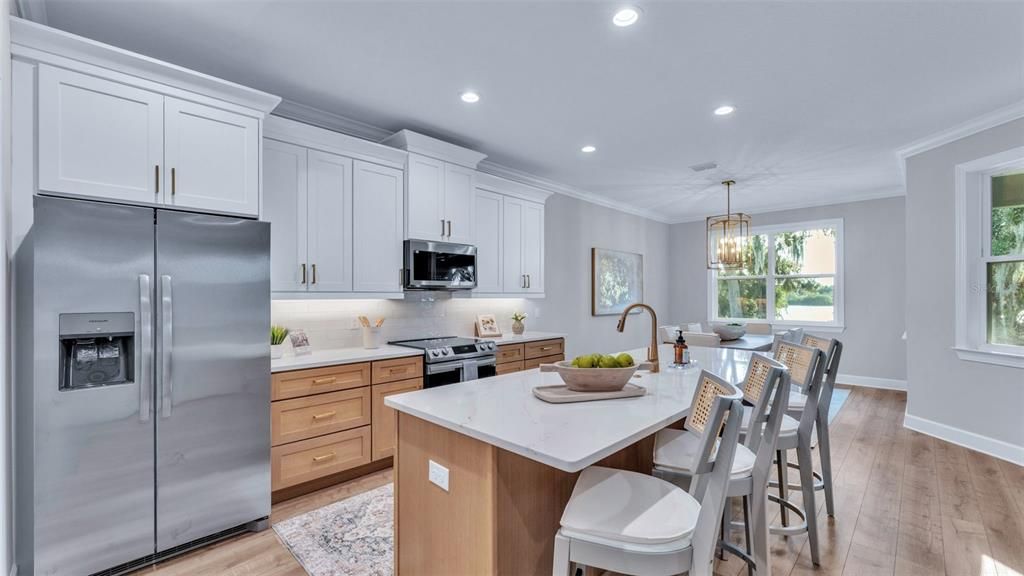 Chandelier, Dining room, Interior, Kitchen, Pendant Lights, Recessed Lighting, Stainless Steel Appliances, Wood Texture Flooring