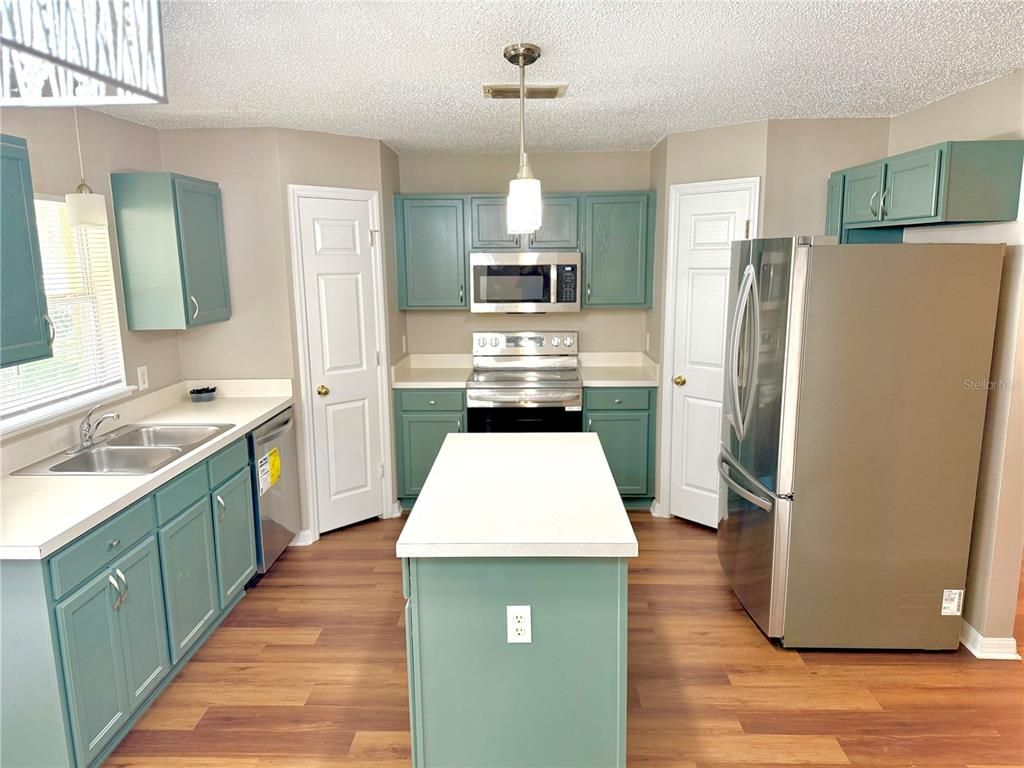 Interior, Kitchen, Pendant Lights, Stainless Steel Appliances, Wood Texture Flooring