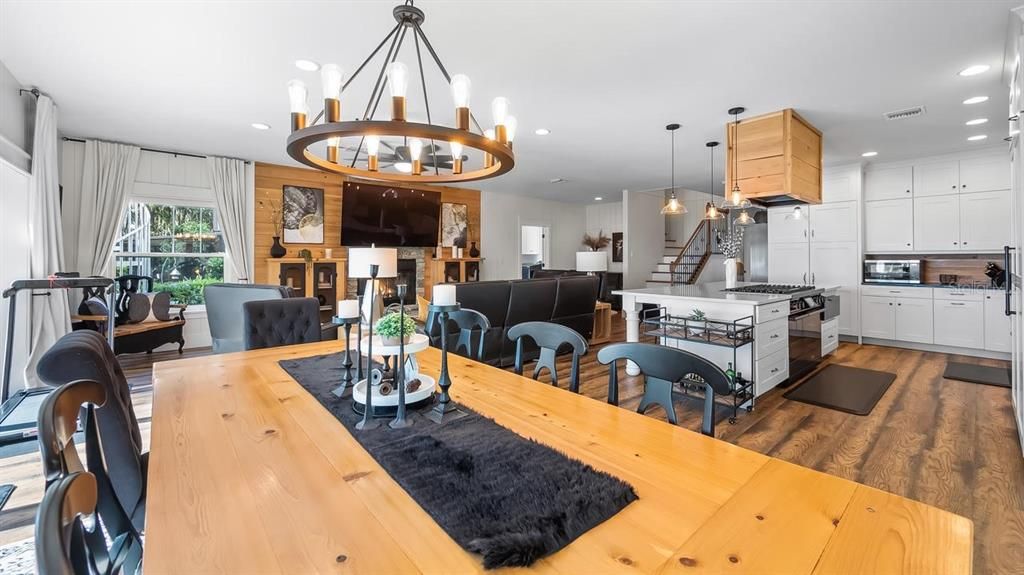Chandelier, Dining room, Interior, Kitchen, Living room, Pendant Lights, Recessed Lighting, Stainless Steel Appliances, Wood Texture Flooring