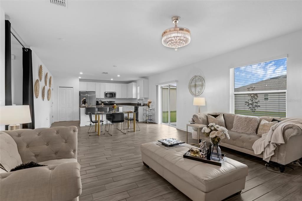 Chandelier, Dining room, Interior, Kitchen, Living room, Recessed Lighting, Stainless Steel Appliances, Wood Texture Flooring