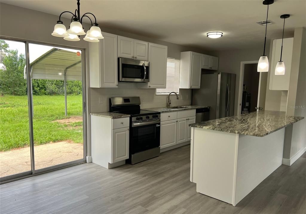 Interior, Kitchen, Pendant Lights, Stainless Steel Appliances, Wood Texture Flooring