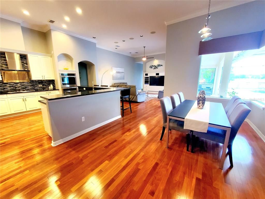 Dining room, Interior, Kitchen, Pendant Lights, Recessed Lighting, Stainless Steel Appliances, Wood Texture Flooring