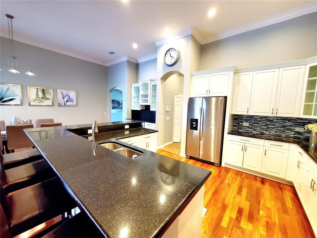 Dining room, Interior, Kitchen, Pendant Lights, Recessed Lighting, Stainless Steel Appliances, Wood Texture Flooring