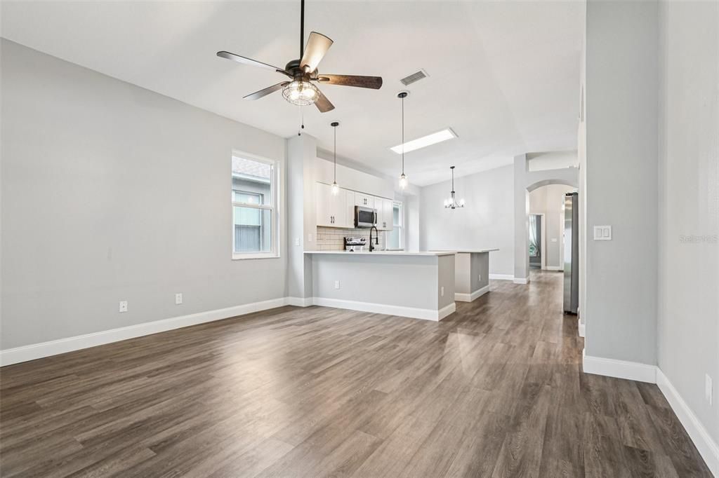 Empty room, Interior, Kitchen, Pendant Lights, Stainless Steel Appliances, Wood Texture Flooring