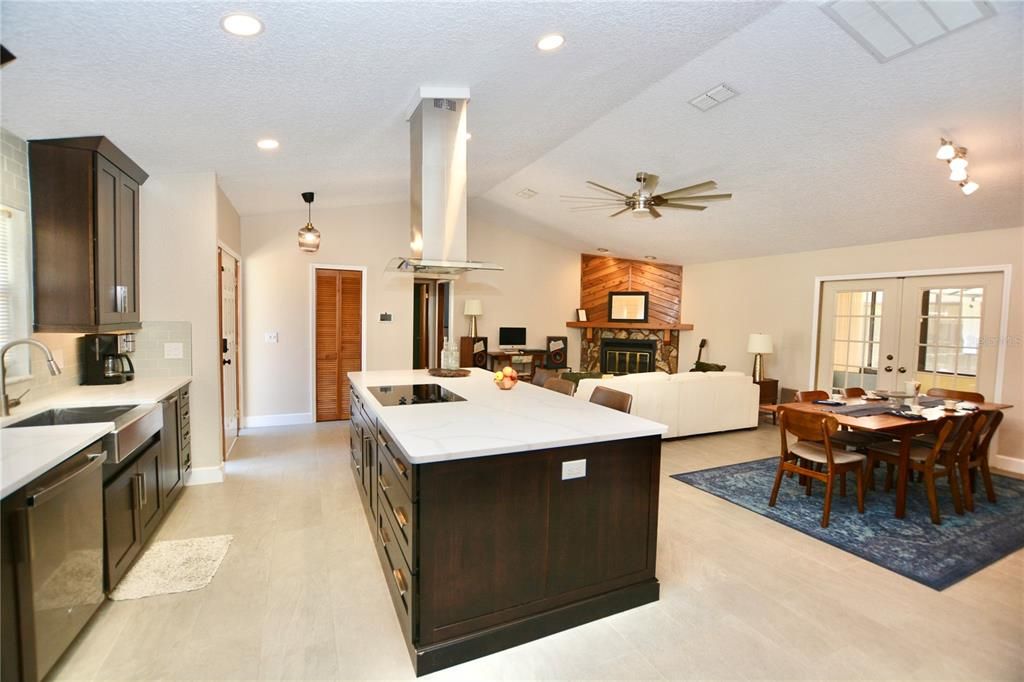Dining room, Fireplace, Interior, Kitchen, Living room, Pendant Lights, Recessed Lighting, Stainless Steel Appliances, Wood Texture Flooring