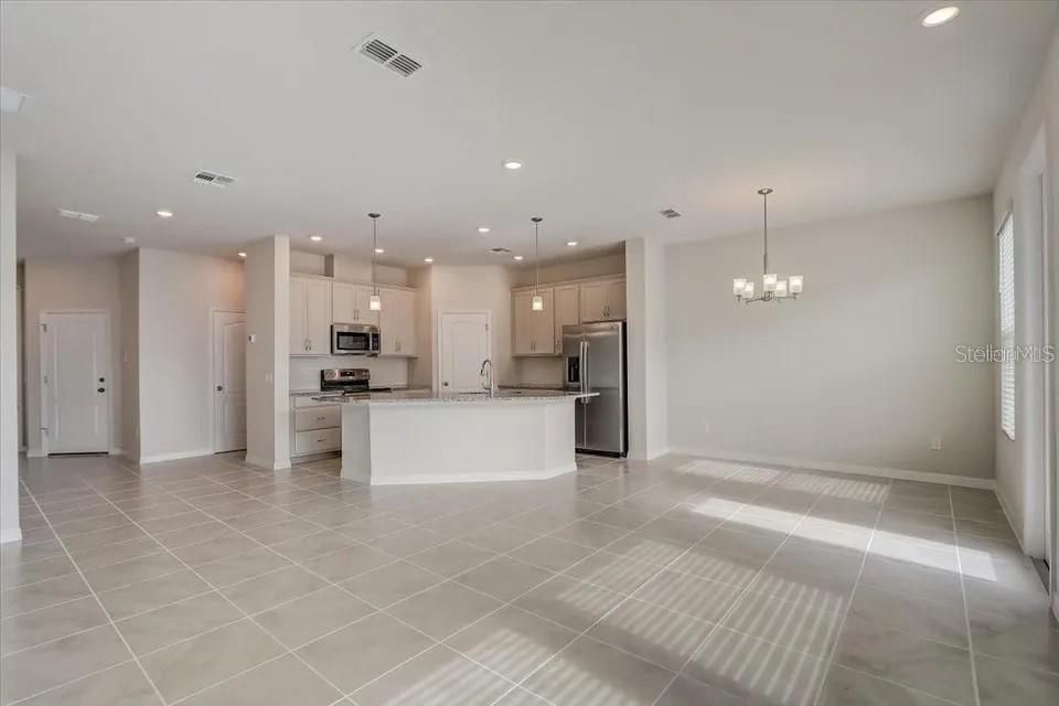 Chandelier, Empty room, Interior, Kitchen, Pendant Lights, Recessed Lighting, Stainless Steel Appliances