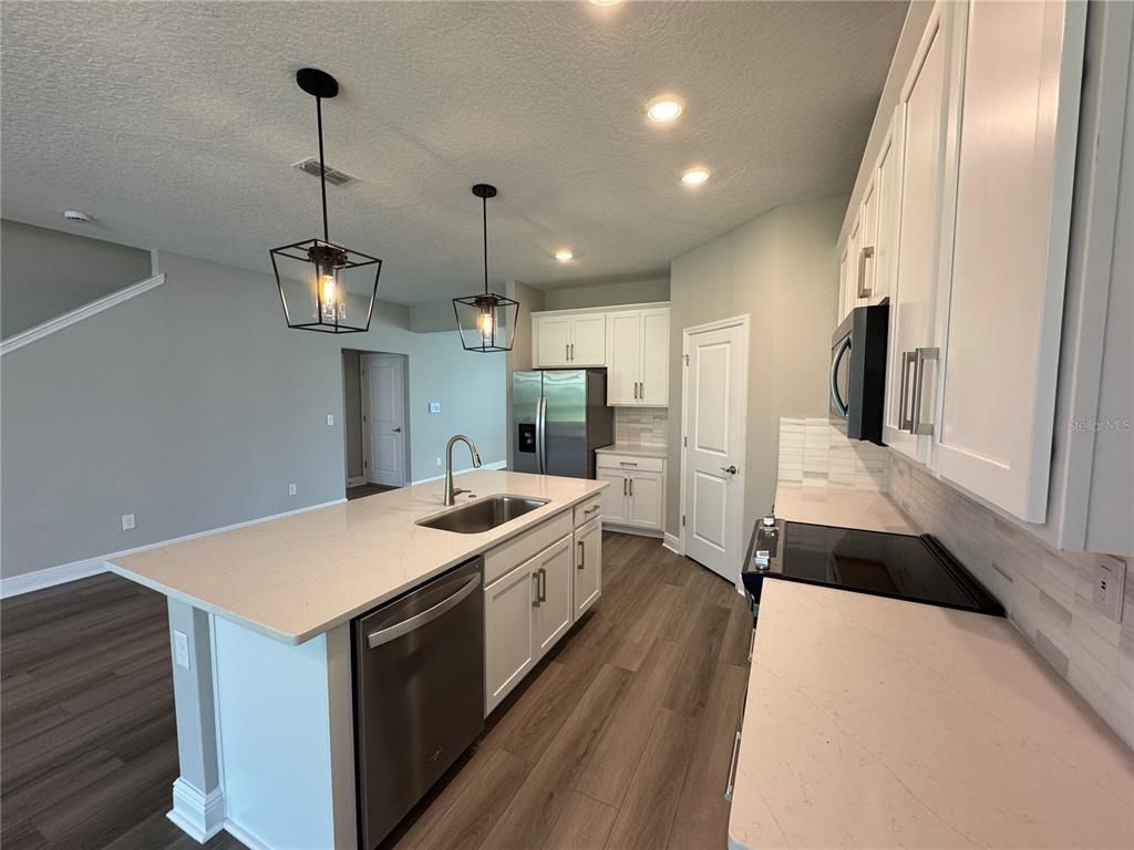 Interior, Kitchen, Pendant Lights, Recessed Lighting, Stainless Steel Appliances, Wood Texture Flooring