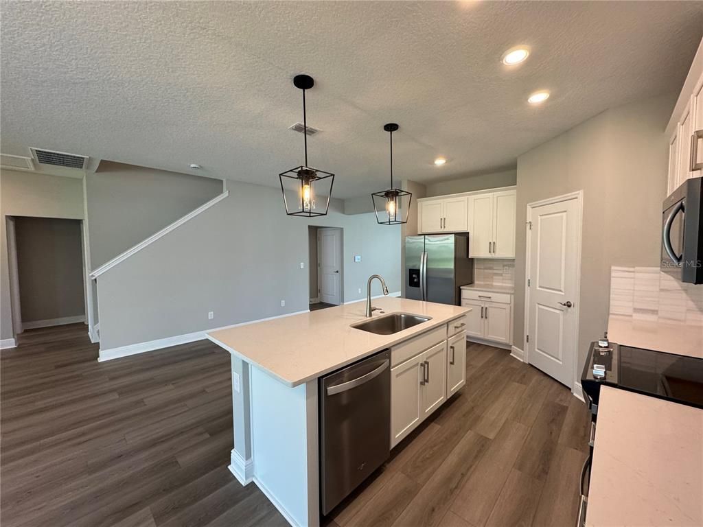Interior, Kitchen, Pendant Lights, Recessed Lighting, Stainless Steel Appliances, Wood Texture Flooring