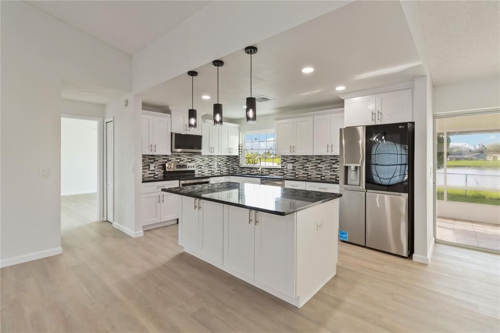 Interior, Kitchen, Pendant Lights, Recessed Lighting, Stainless Steel Appliances, Wood Texture Flooring