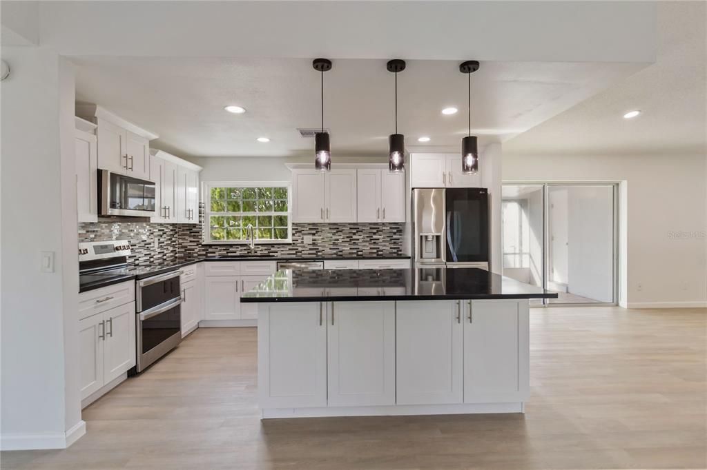 Interior, Kitchen, Pendant Lights, Recessed Lighting, Stainless Steel Appliances, Wood Texture Flooring