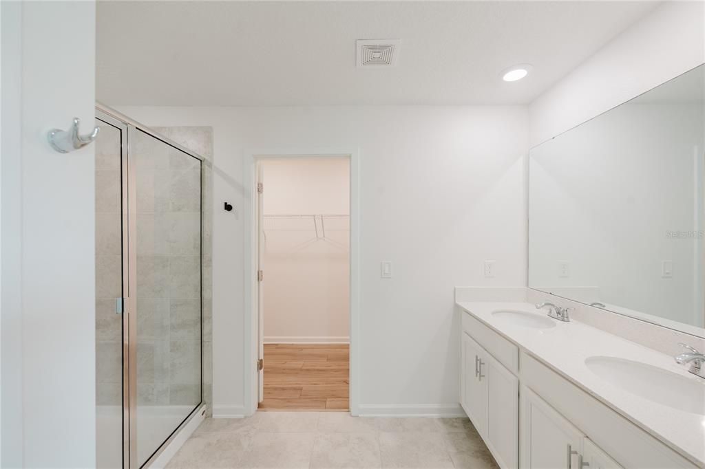 Bathroom, Dual Sink Vanities, Glass Shower, Interior, Recessed Lighting, Wood Texture Flooring