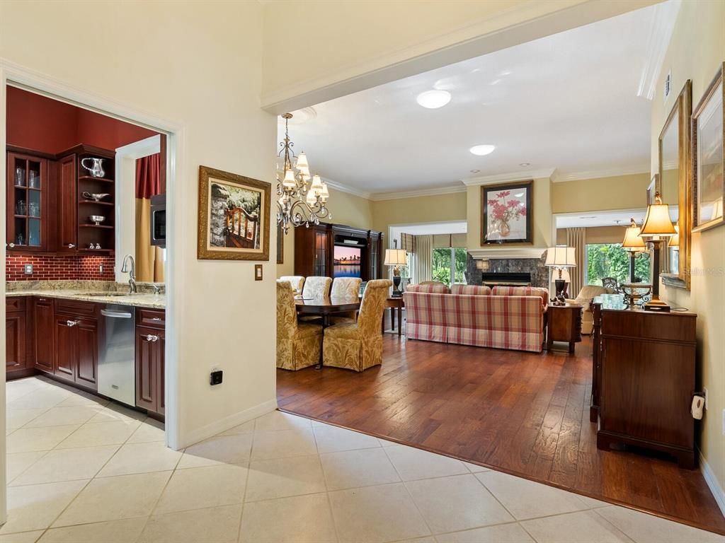 Chandelier, Fireplace, Interior, Kitchen, Living room, Recessed Lighting, Wood Texture Flooring