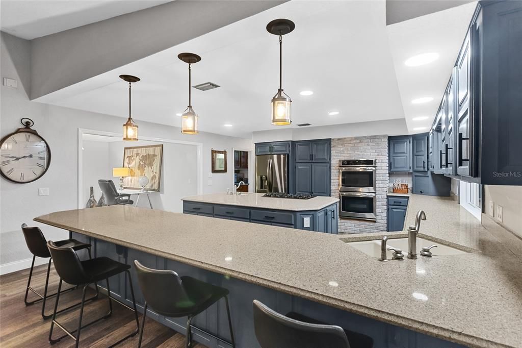 Interior, Kitchen, Pendant Lights, Recessed Lighting, Stainless Steel Appliances, Stone Walls, Wood Texture Flooring