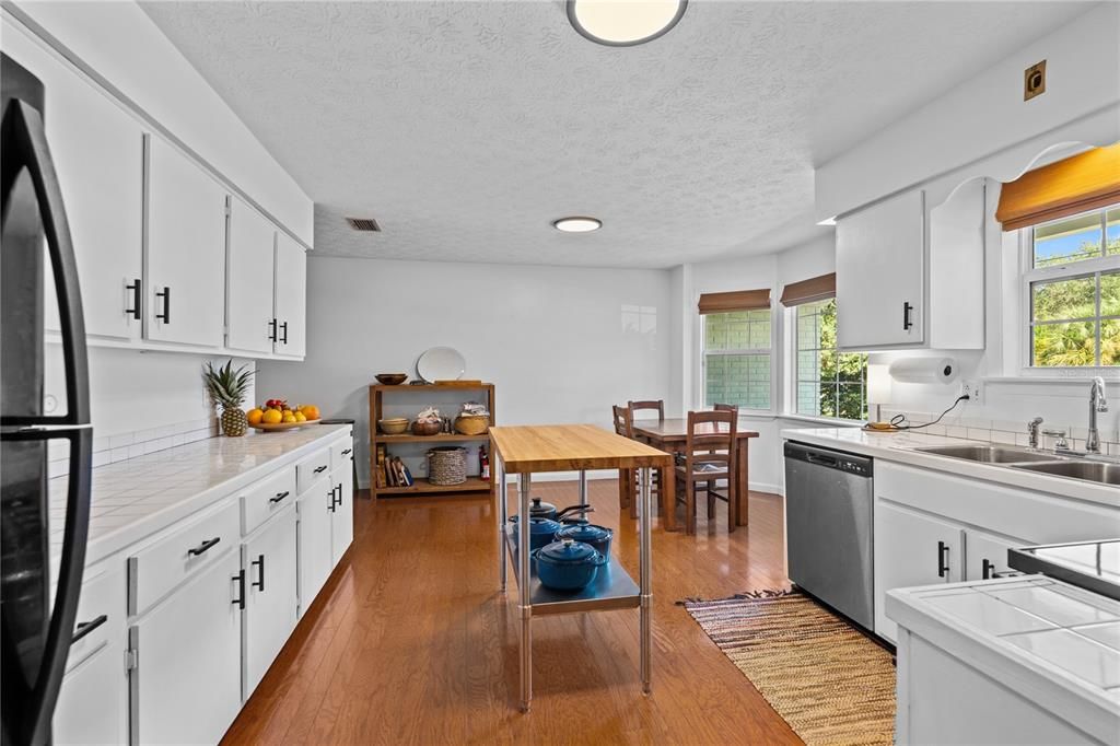 Dining room, Interior, Kitchen, Recessed Lighting, Tile Countertops, Wood Texture Flooring