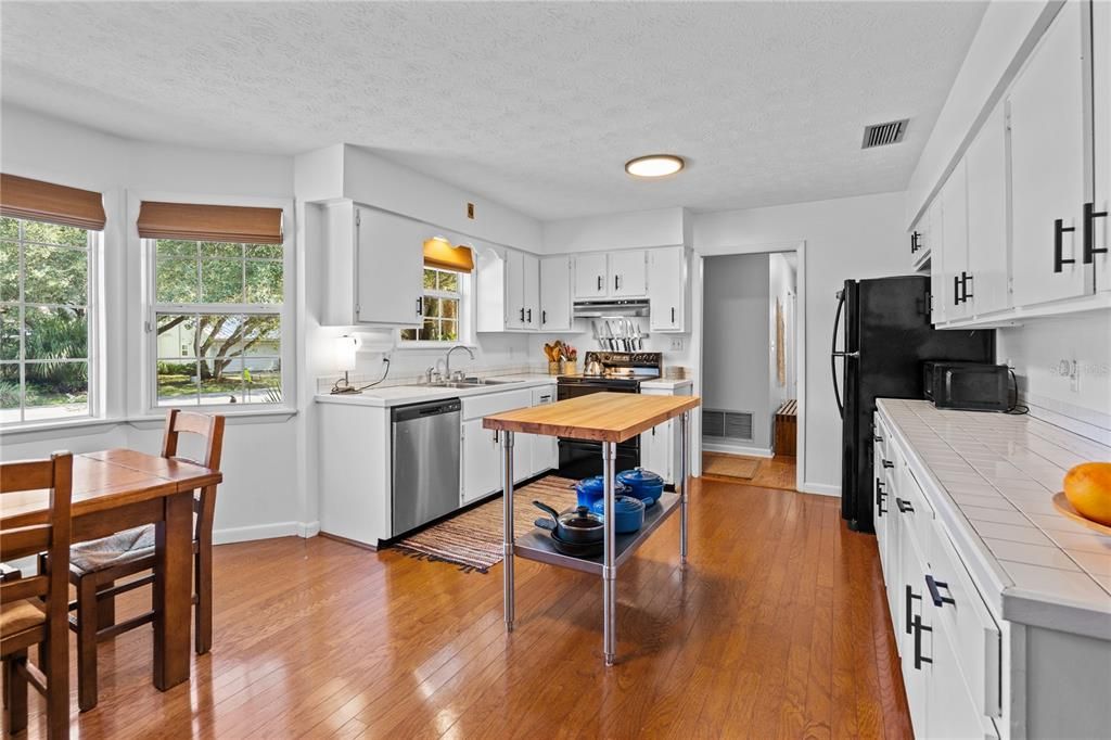 Dining room, Interior, Kitchen, Recessed Lighting, Tile Countertops, Wood Texture Flooring