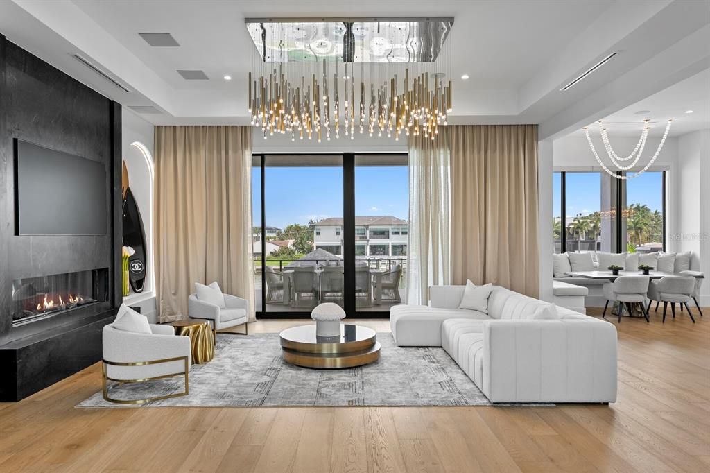 Dining room, Fireplace, Interior, Living room, Pendant Lights, Recessed Lighting, Wood Texture Flooring