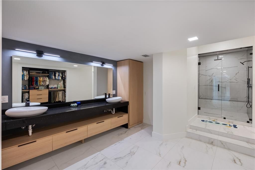 Bathroom, Dual Sink Vanities, Glass Shower, Interior, Marble, Marble Walls, Recessed Lighting