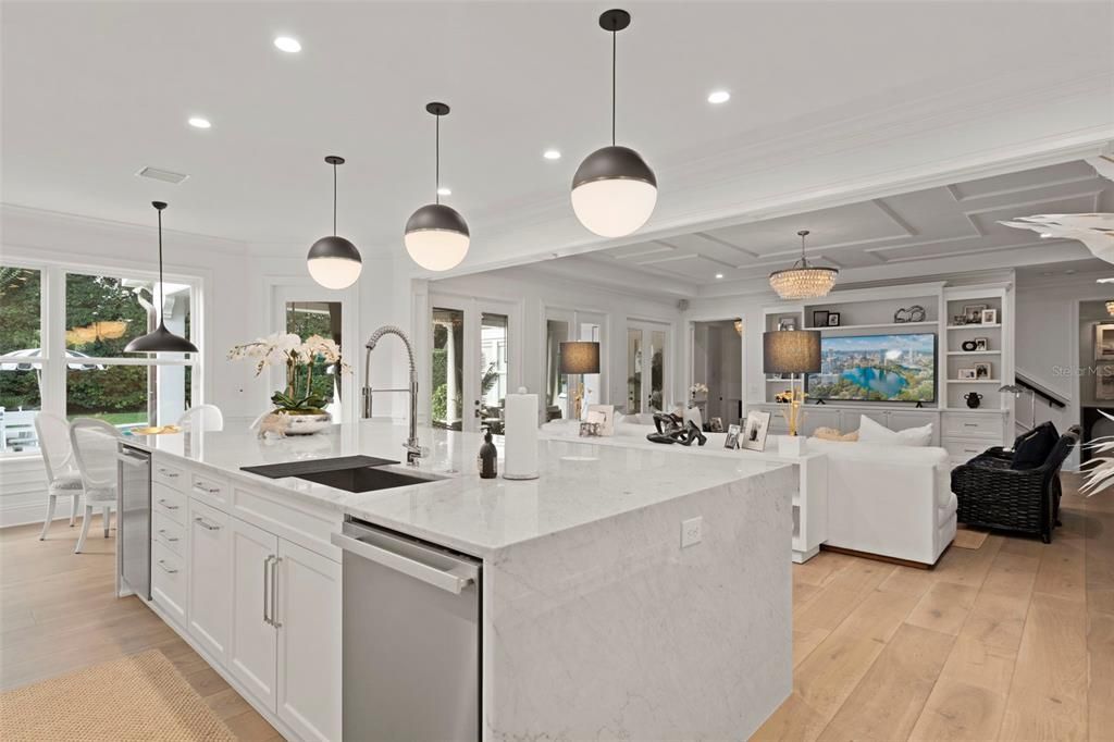 Chandelier, Dining room, Interior, Kitchen, Living room, Pendant Lights, Recessed Lighting, Stainless Steel Appliances, Wood Texture Flooring