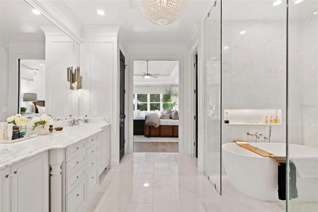 Bathroom, Bedroom, Chandelier, Dual Sink Vanities, Free Standing Baths, Interior, Marble, Marble Walls, Recessed Lighting, Wood Texture Flooring