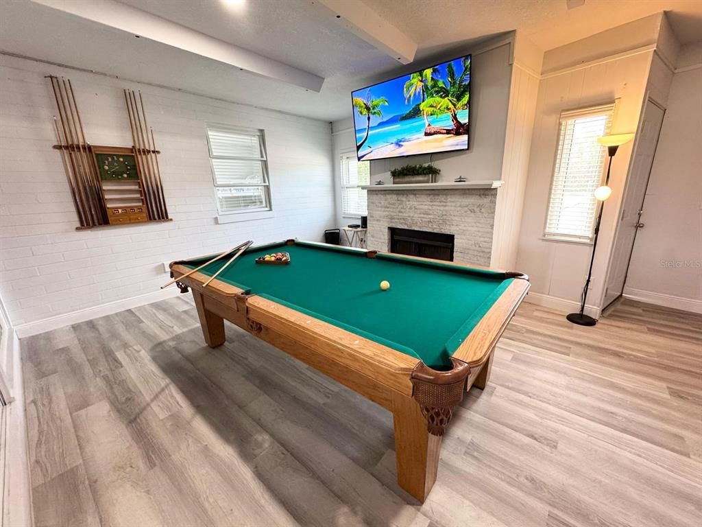 Billiard Table, Fireplace, Game Room, Interior, Recessed Lighting, Stone Walls, Wood Texture Flooring