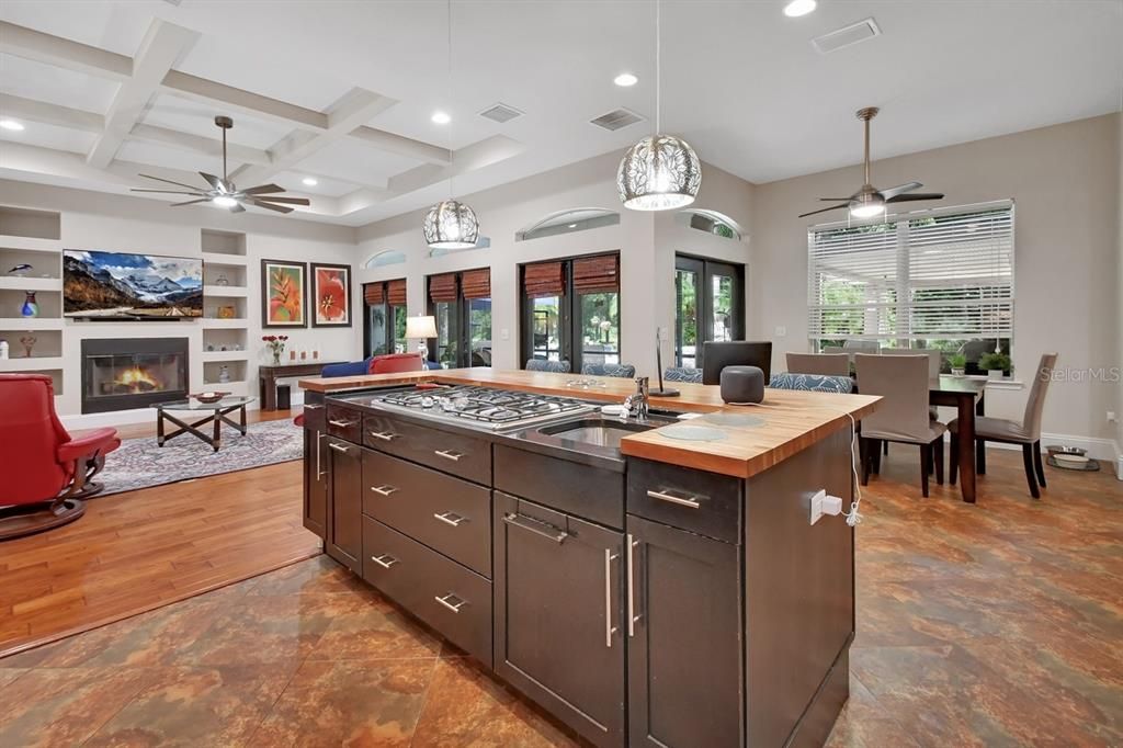 Dining room, Fireplace, Interior, Living room, Pendant Lights, Recessed Lighting, Wood Texture Flooring