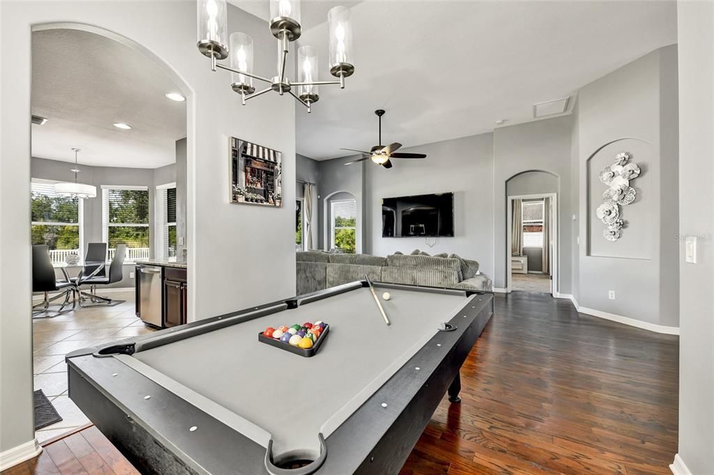 Billiard Table, Chandelier, Game Room, Interior, Pendant Lights, Recessed Lighting, Wood Texture Flooring
