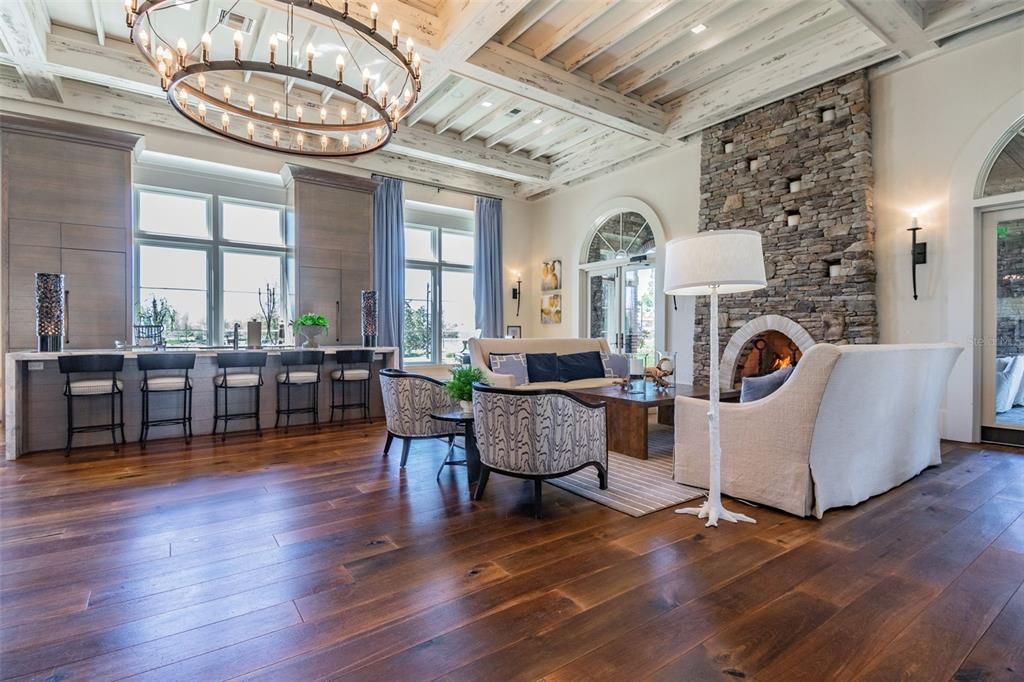 Chandelier, Fireplace, Interior, Living room, Recessed Lighting, Stone Walls, Wood Texture Flooring