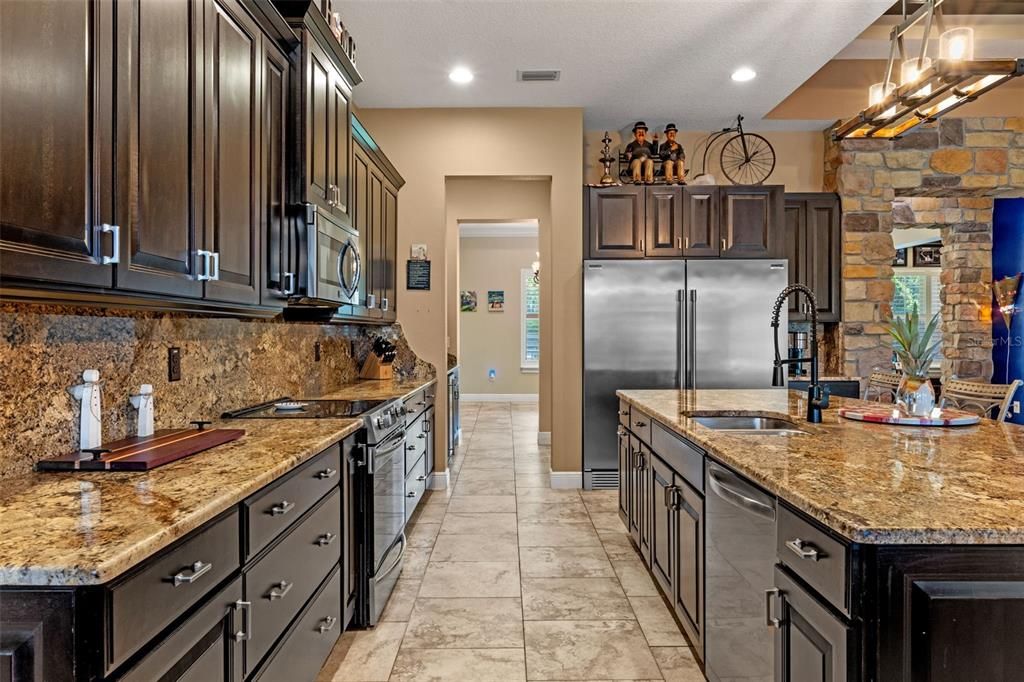 Interior, Kitchen, Pendant Lights, Recessed Lighting, Stainless Steel Appliances, Stone Walls