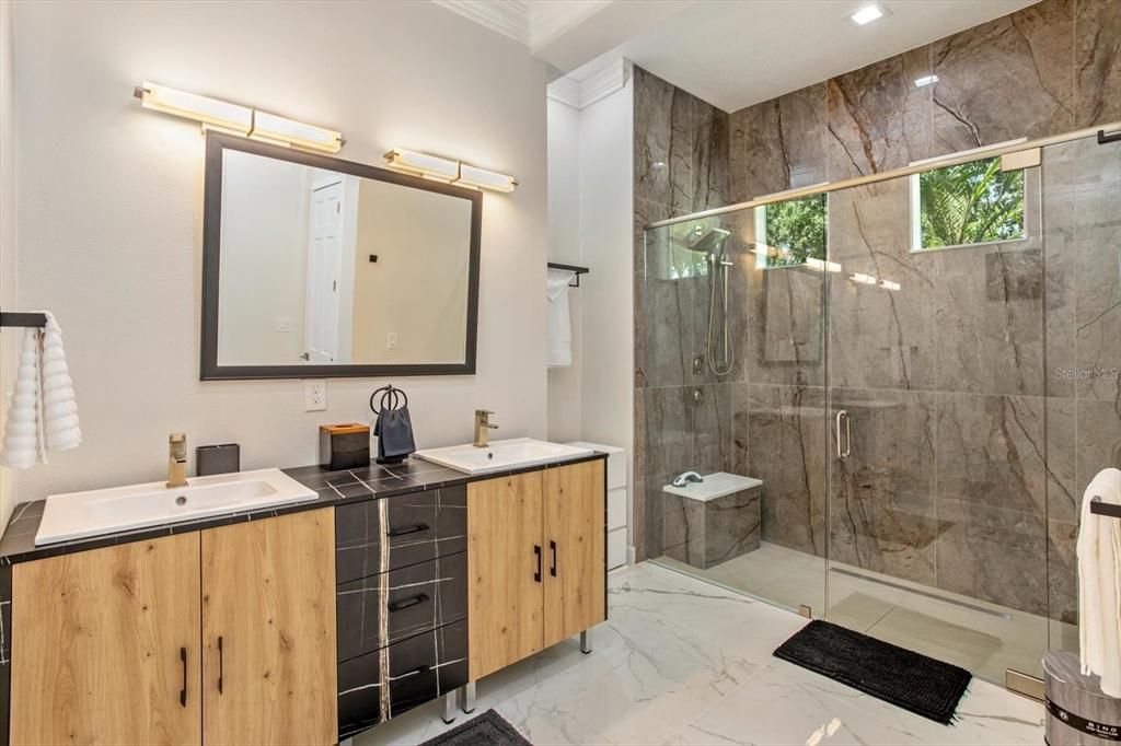 Bathroom, Dual Sink Vanities, Glass Shower, Interior, Marble, Marble Walls, Recessed Lighting