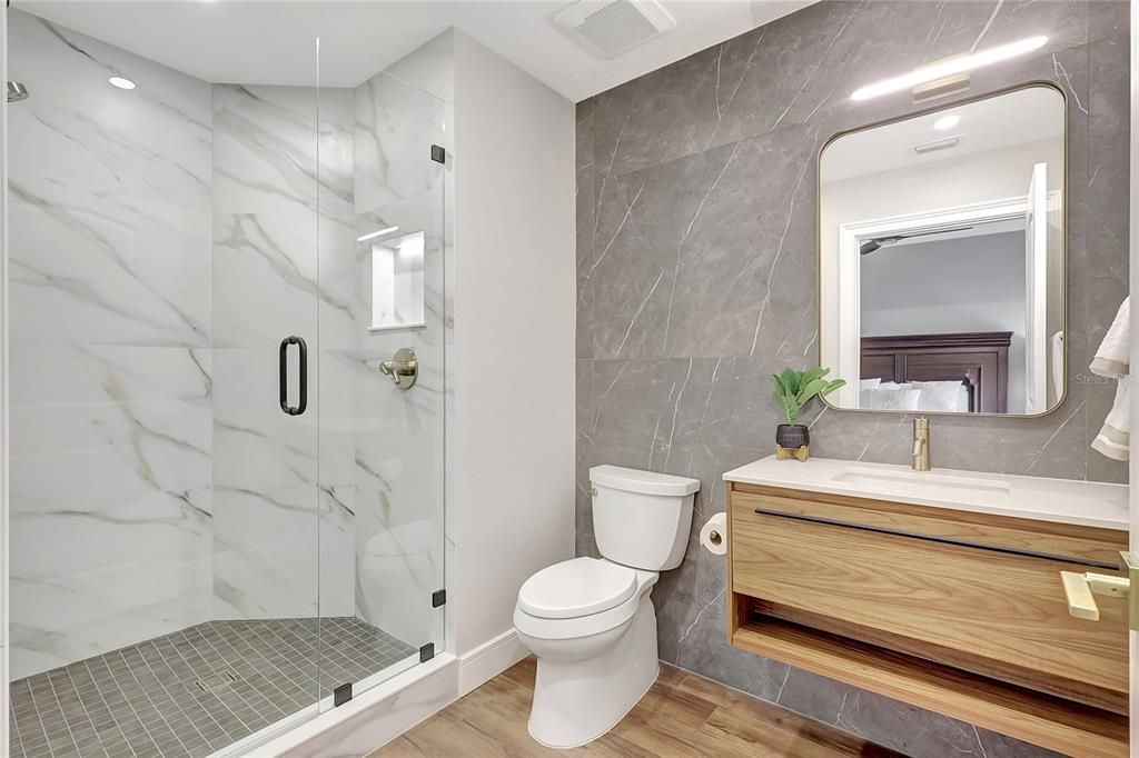 Bathroom, Glass Shower, Interior, Marble Walls, Recessed Lighting, Wood Texture Flooring