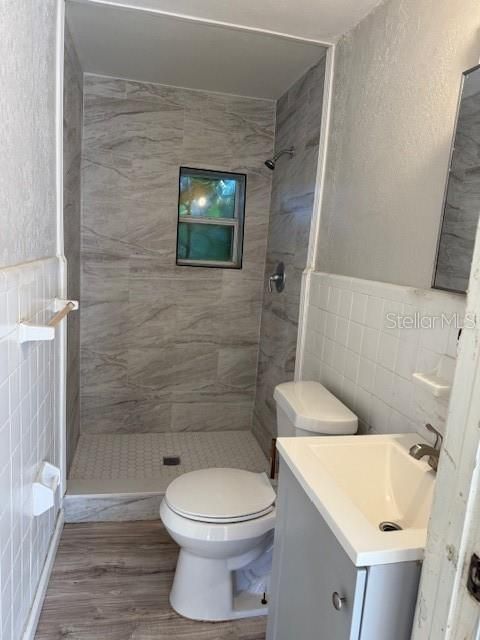 Bathroom, Glass Shower, Interior, Marble Walls, Wood Texture Flooring