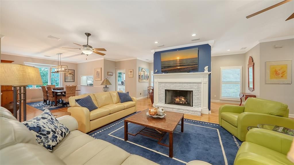 Dining room, Fireplace, Interior, Living room, Pendant Lights, Recessed Lighting, Wood Texture Flooring