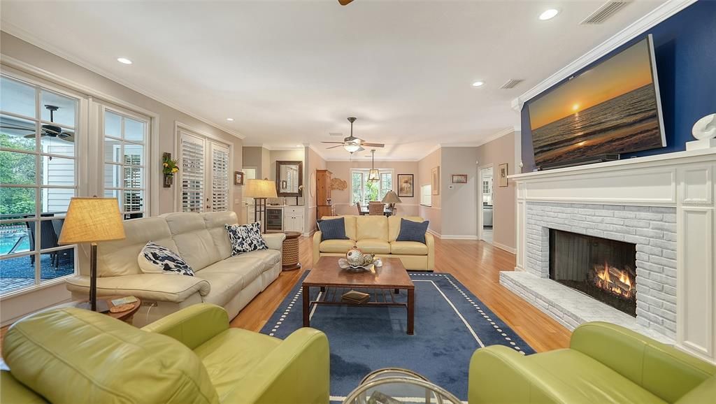 Dining room, Fireplace, Interior, Living room, Recessed Lighting, Wood Texture Flooring