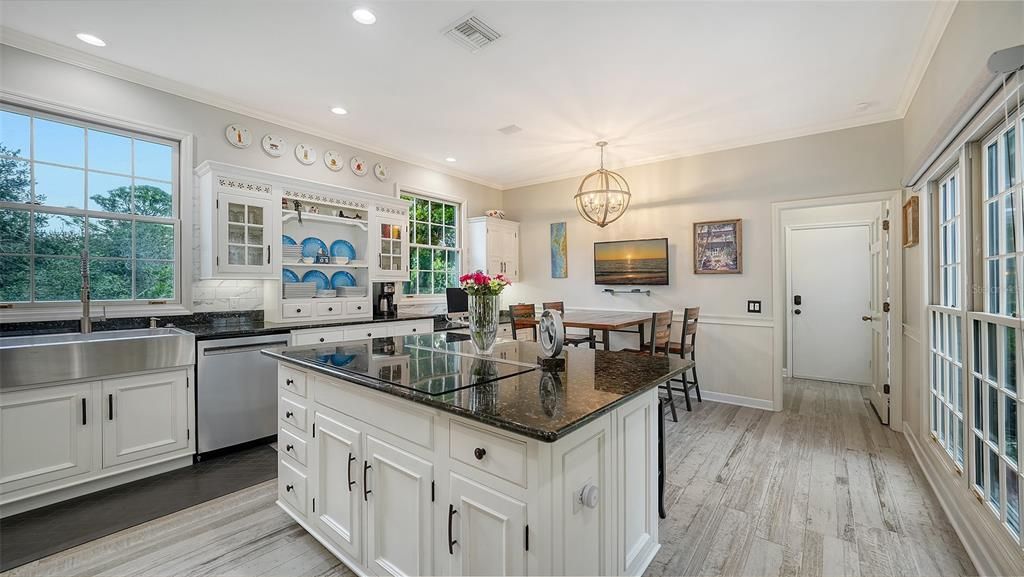 Chandelier, Dining room, Interior, Kitchen, Pendant Lights, Recessed Lighting, Stainless Steel Appliances, Wood Texture Flooring