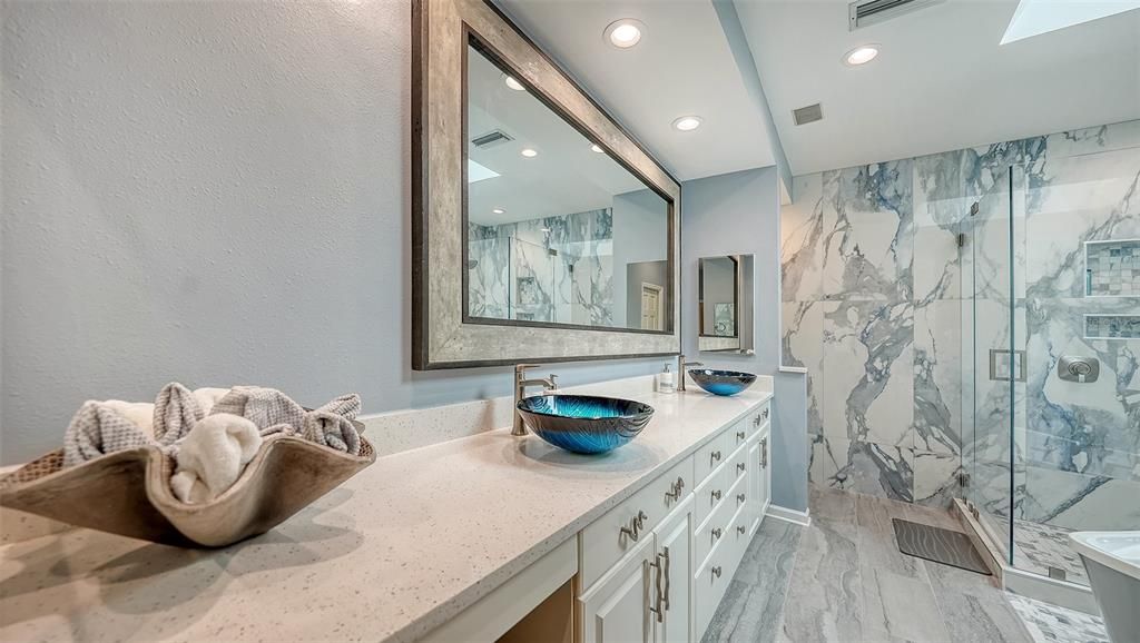 Bathroom, Dual Sink Vanities, Glass Shower, Interior, Marble, Marble Walls, Recessed Lighting