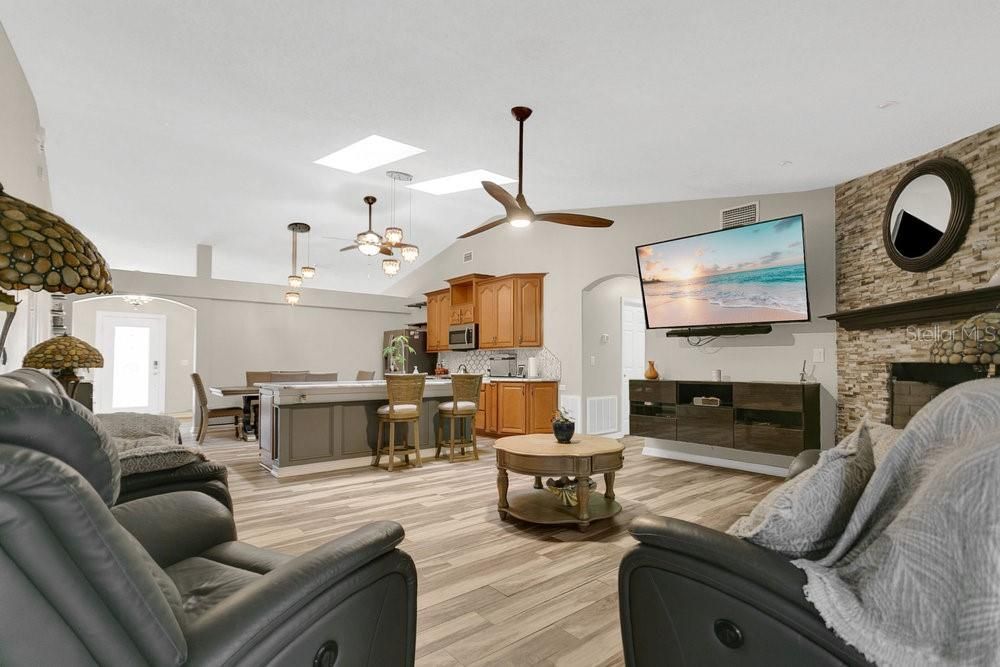 Dining room, Fireplace, Interior, Kitchen, Living room, Pendant Lights, Stone Walls, Wood Texture Flooring