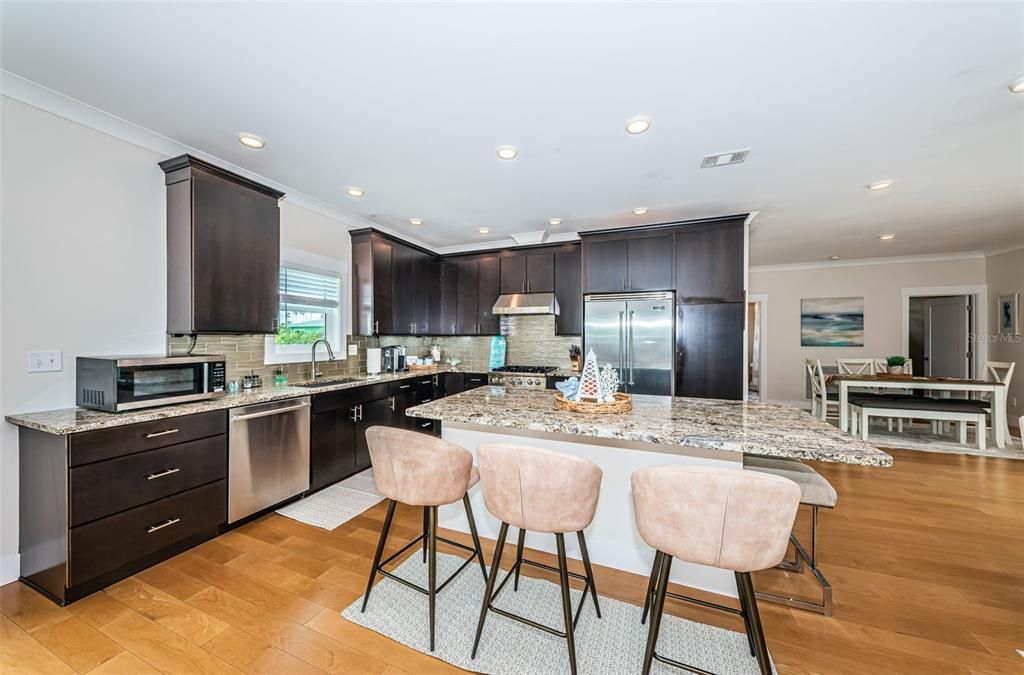 Dining room, Interior, Kitchen, Recessed Lighting, Stainless Steel Appliances, Wood Texture Flooring