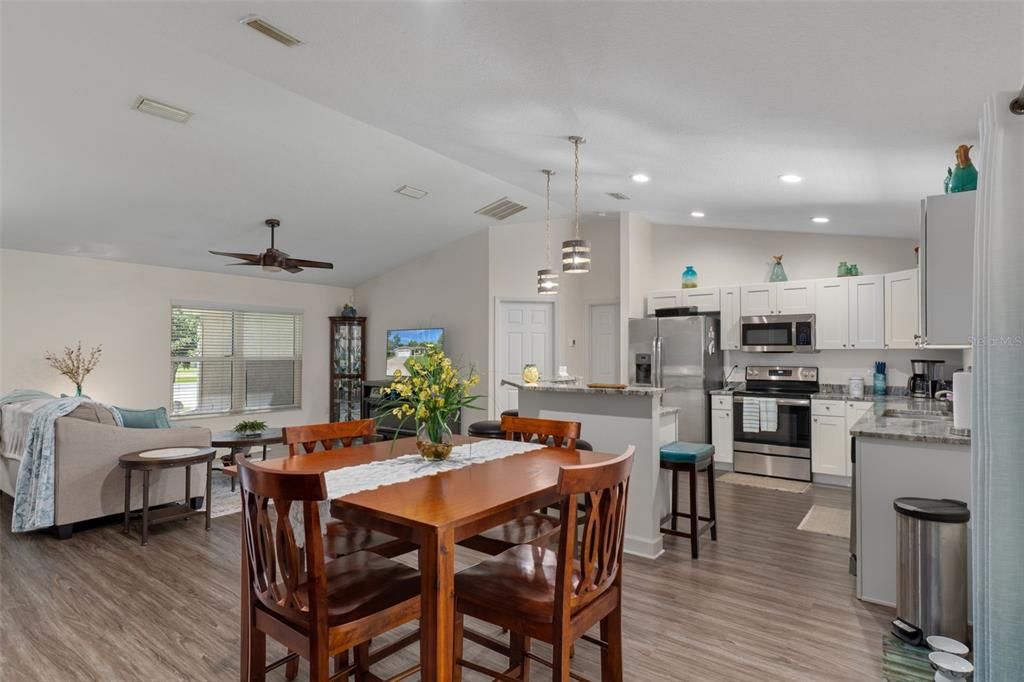 Dining room, Interior, Kitchen, Living room, Pendant Lights, Recessed Lighting, Stainless Steel Appliances, Wood Texture Flooring