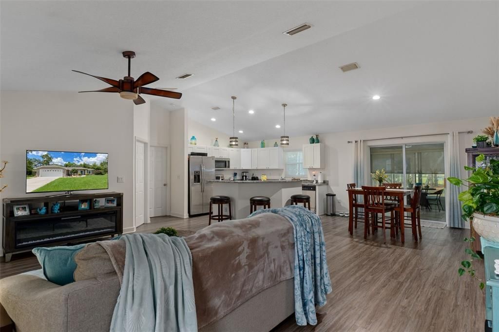 Dining room, Interior, Kitchen, Pendant Lights, Recessed Lighting, Stainless Steel Appliances, Wood Texture Flooring