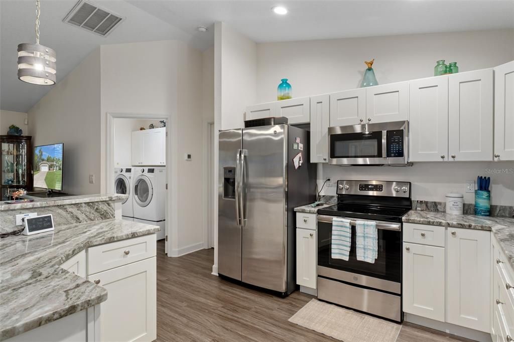 Interior, Kitchen, Recessed Lighting, Stainless Steel Appliances, Washer, Wood Texture Flooring