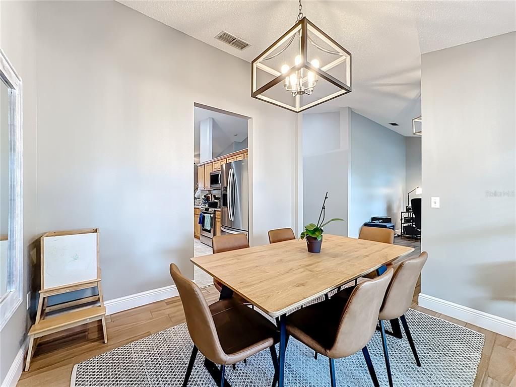 Dining room, Interior, Pendant Lights, Stainless Steel Appliances, Wood Texture Flooring