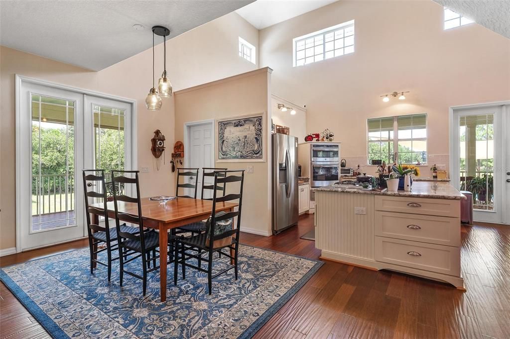 Dining room, Interior, Kitchen, Pendant Lights, Stainless Steel Appliances, Wood Texture Flooring