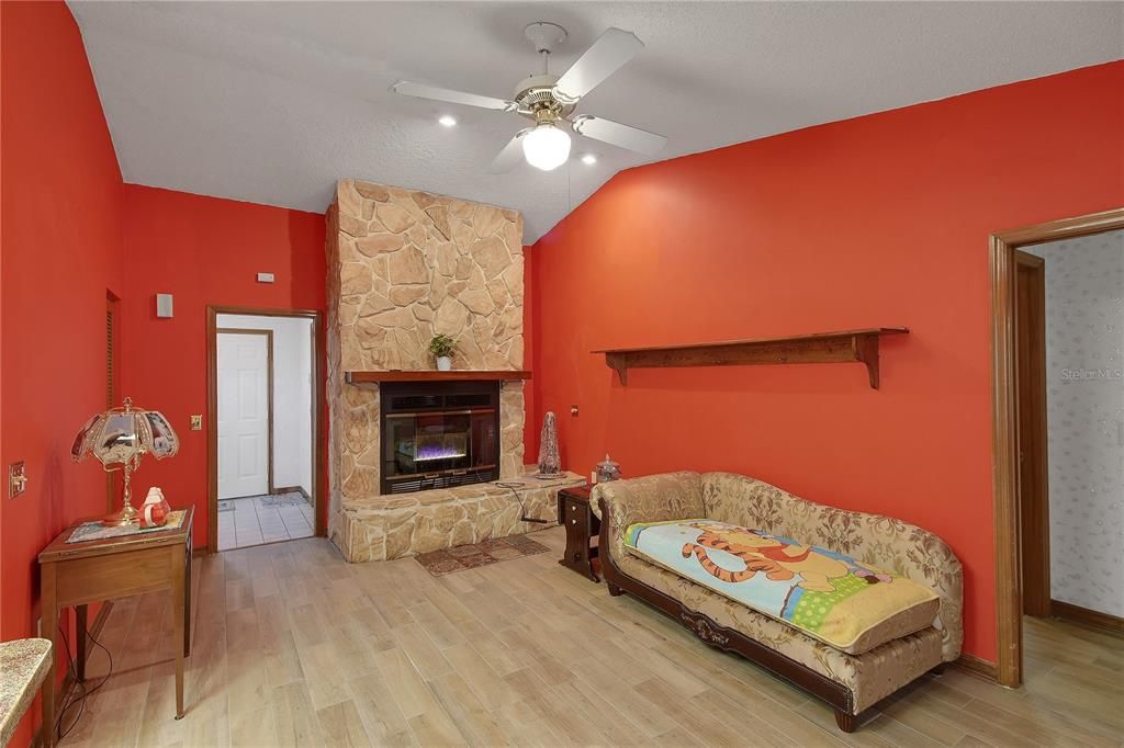 Fireplace, Interior, Recessed Lighting, Stone Walls, Wood Texture Flooring