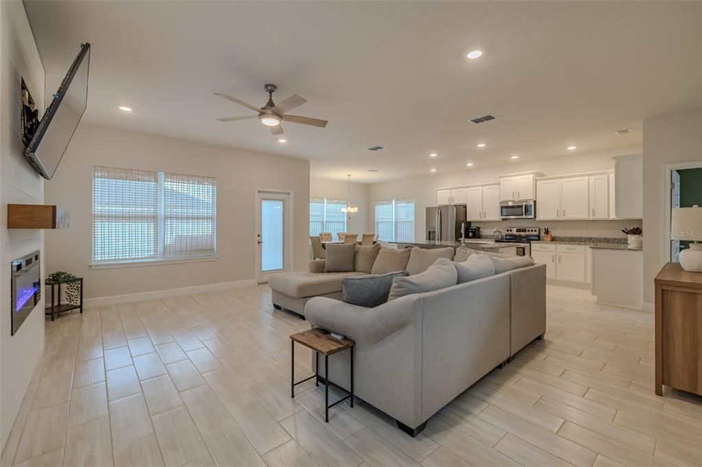 Dining room, Fireplace, Interior, Kitchen, Living room, Pendant Lights, Recessed Lighting, Stainless Steel Appliances, Wood Texture Flooring