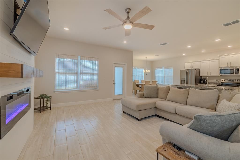 Chandelier, Dining room, Interior, Kitchen, Living room, Recessed Lighting, Stainless Steel Appliances, Wood Texture Flooring