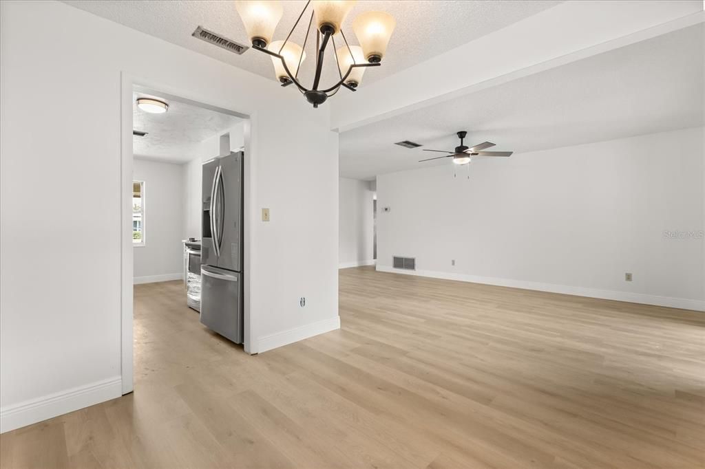 Chandelier, Empty room, Interior, Kitchen, Pendant Lights, Stainless Steel Appliances, Wood Texture Flooring