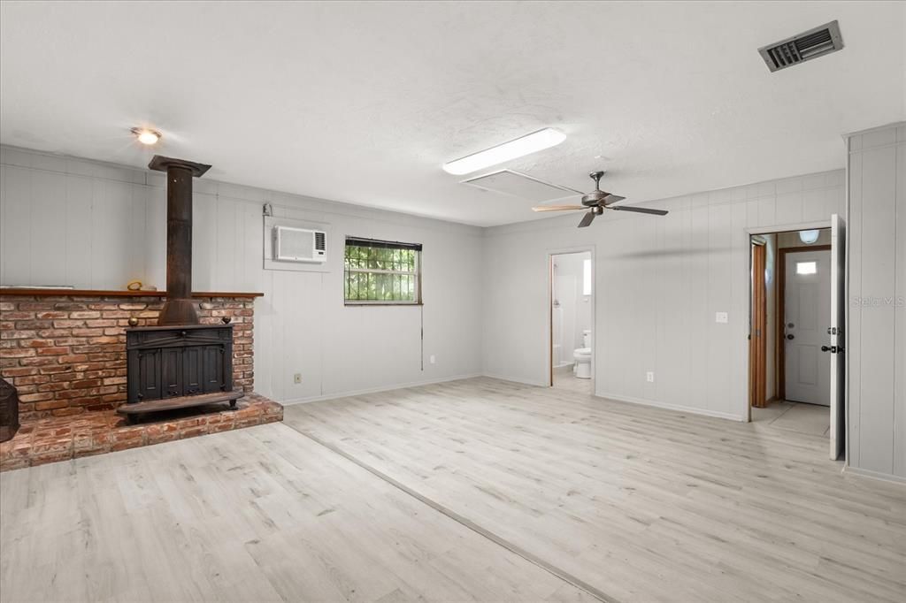 Empty room, Fireplace, Interior, Stone Walls, Wood Texture Flooring