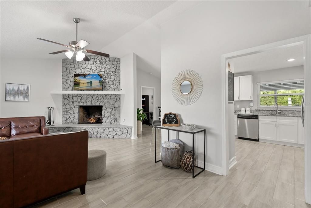 Fireplace, Interior, Kitchen, Recessed Lighting, Stone Walls, Wood Texture Flooring